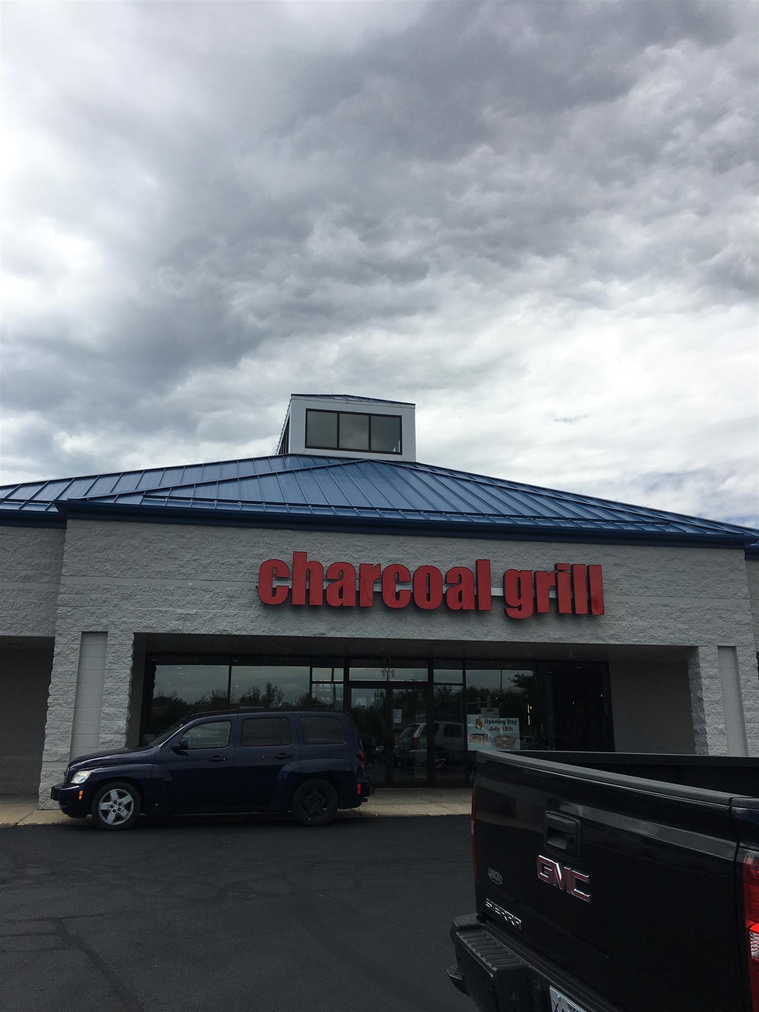 Milwaukee restaurant painting contractors painted the blue metal roof and white exterior of this bar and grill