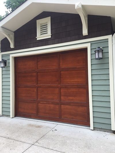 We can refinish and stain doors on your house or garage Milwaukee wood staining service