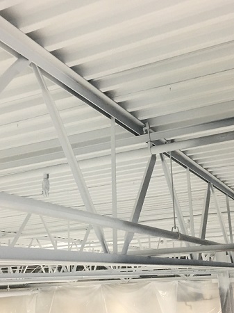Factory ceiling refinished by Racine metal roof painters