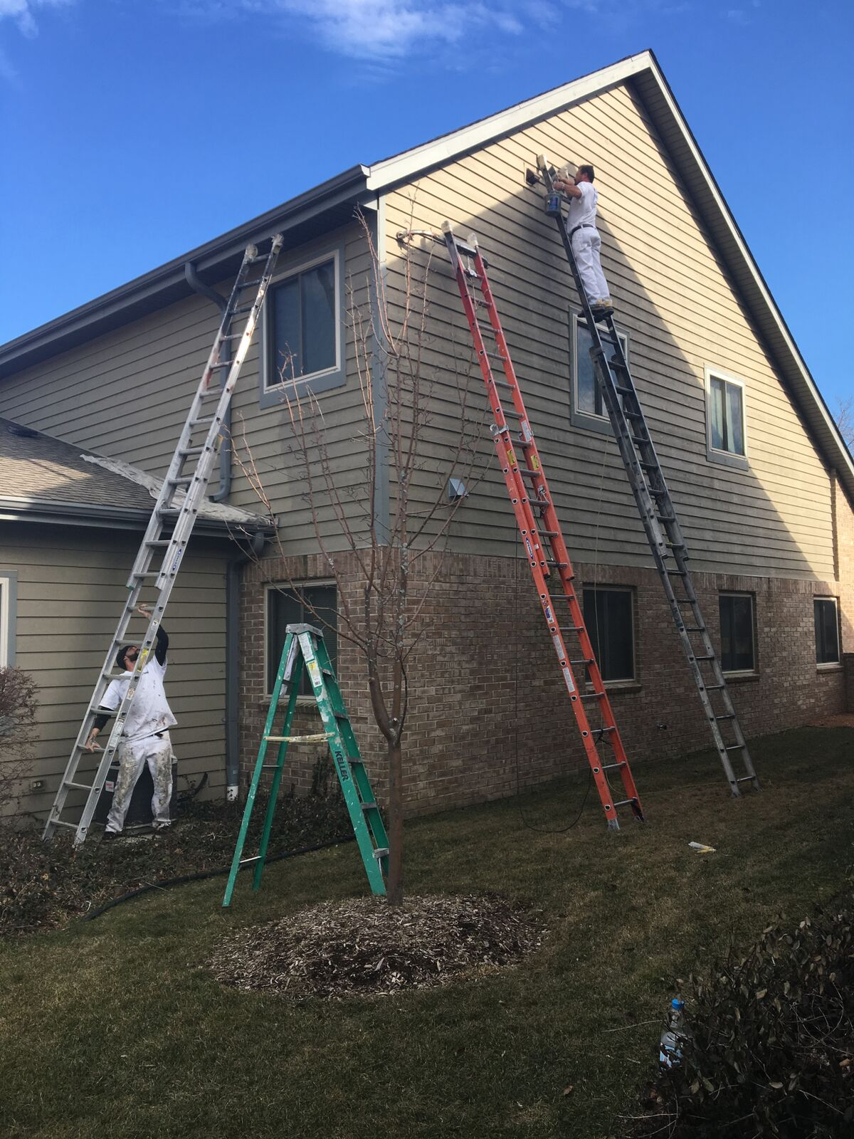 Professional painting contractors finishing up a home in Oak Creek